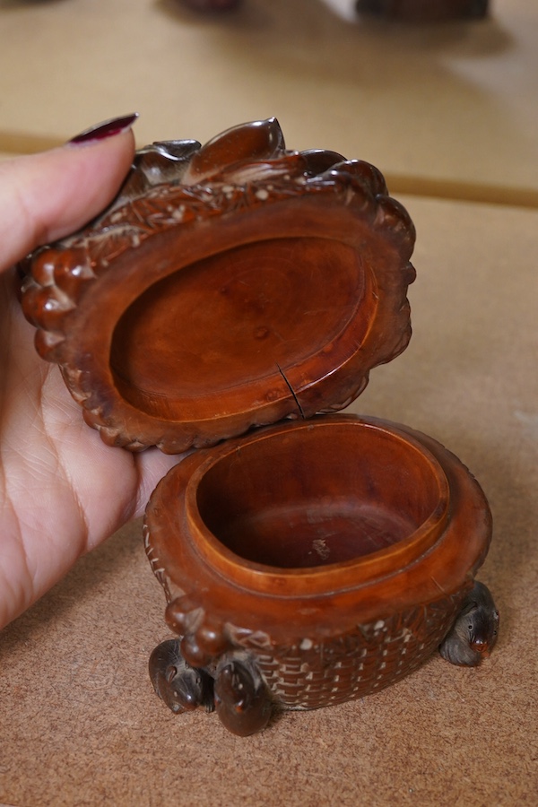 A Japanese boxwood koro and cover, Meiji period, modelled as a basket of fruit with mice, signed to the base, 9cm wide. Condition - fair to good, some chipping